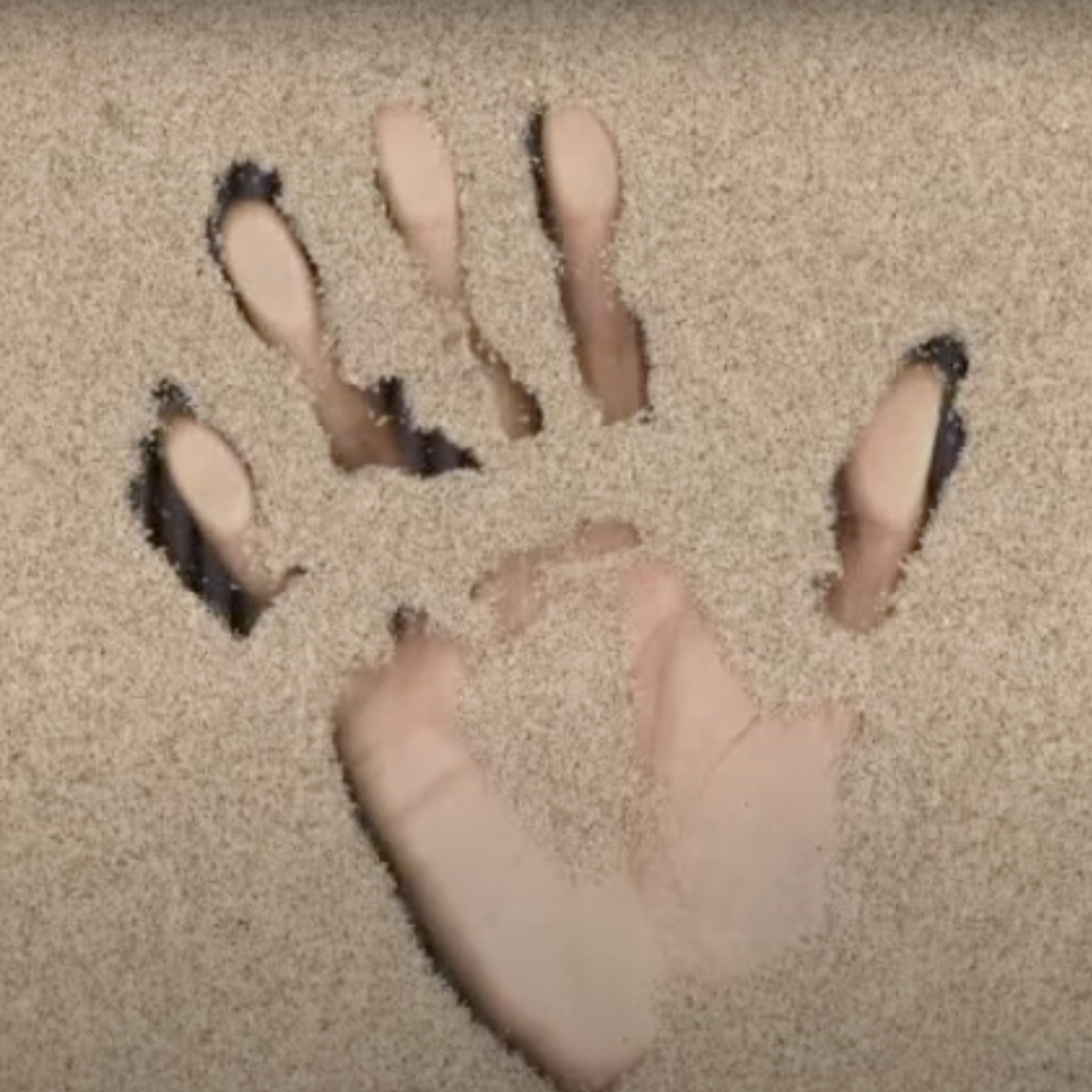 hand on sand